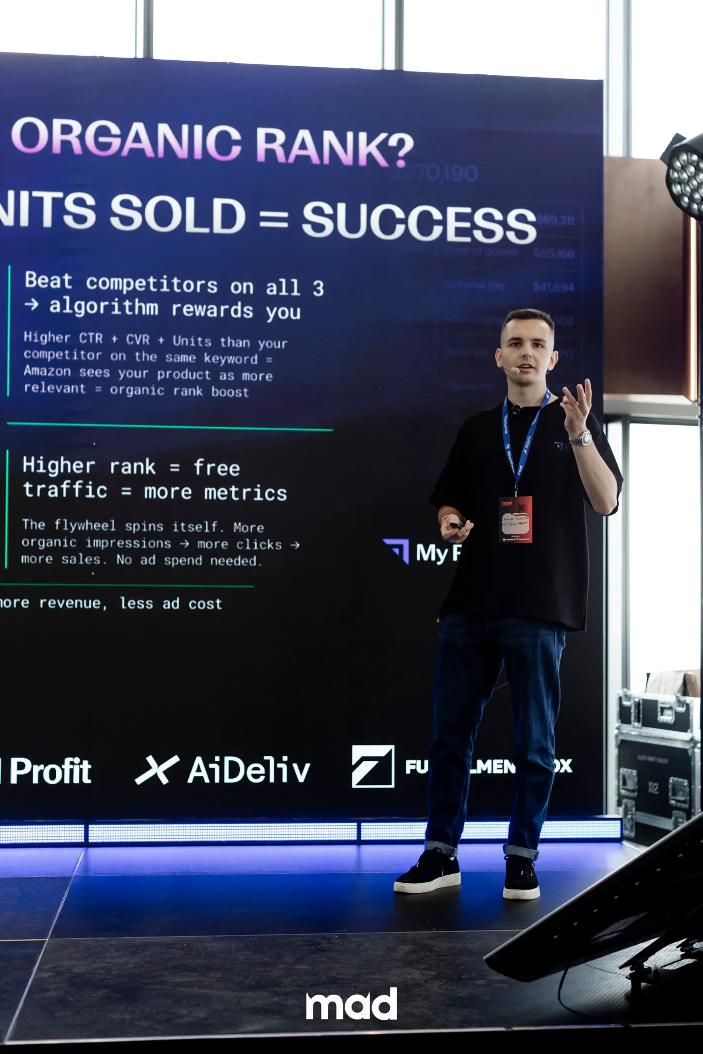 Demian Lazurko on stage explaining what moves a brand's organic rank on Amazon